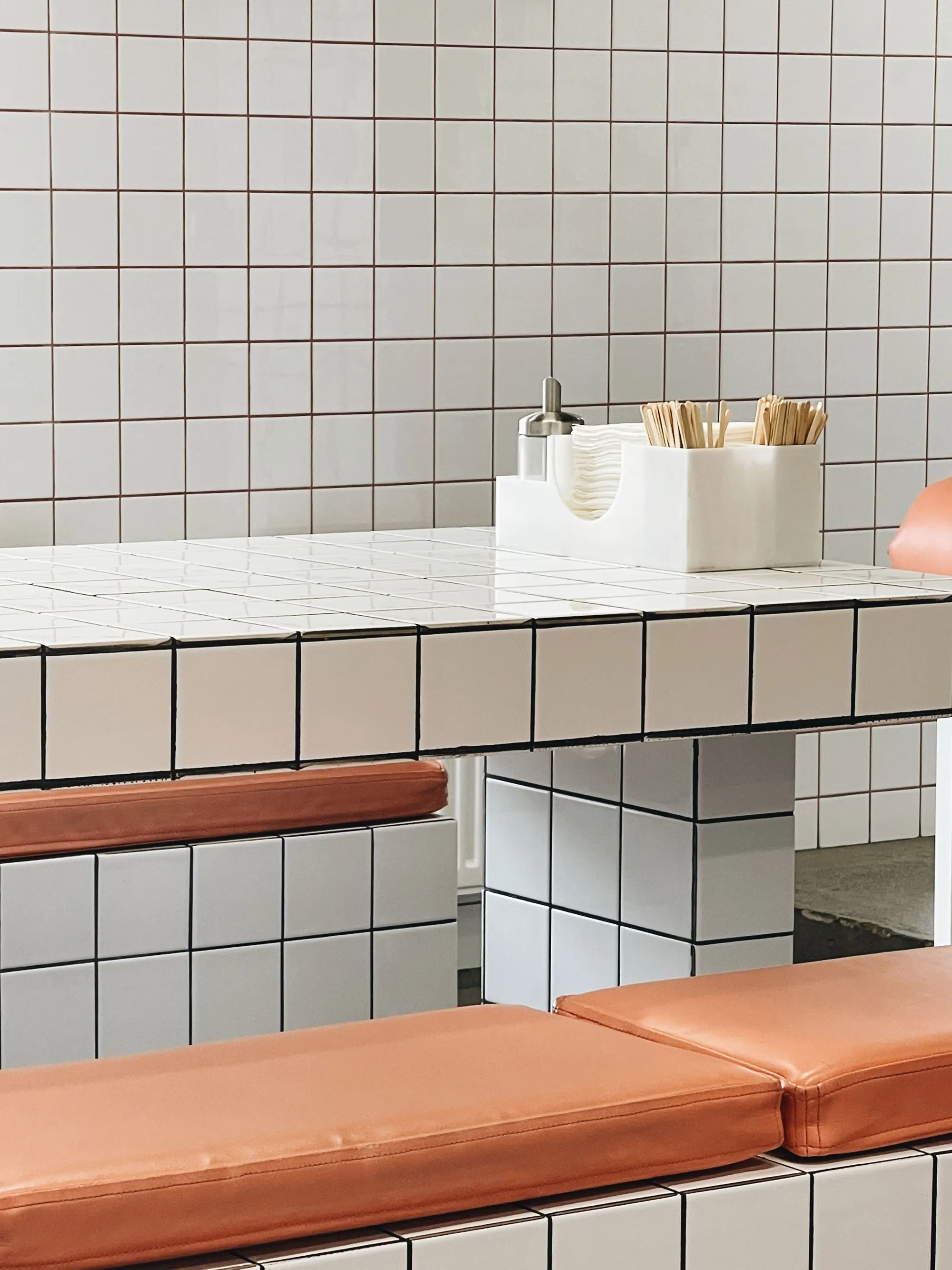 White tiled bench in a restaurant