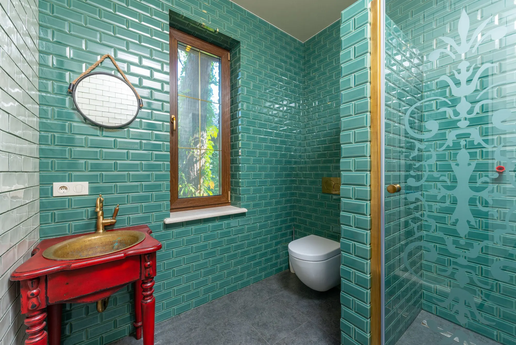 Green subway tiles in a small bathroom