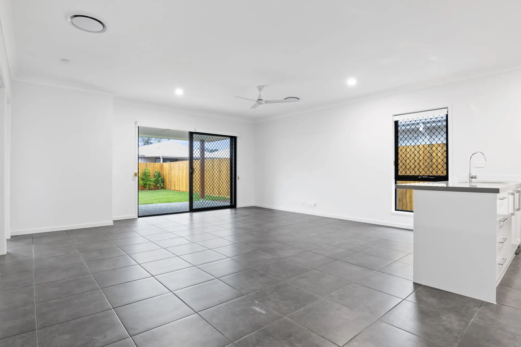 Large grey floor tiles through a new home