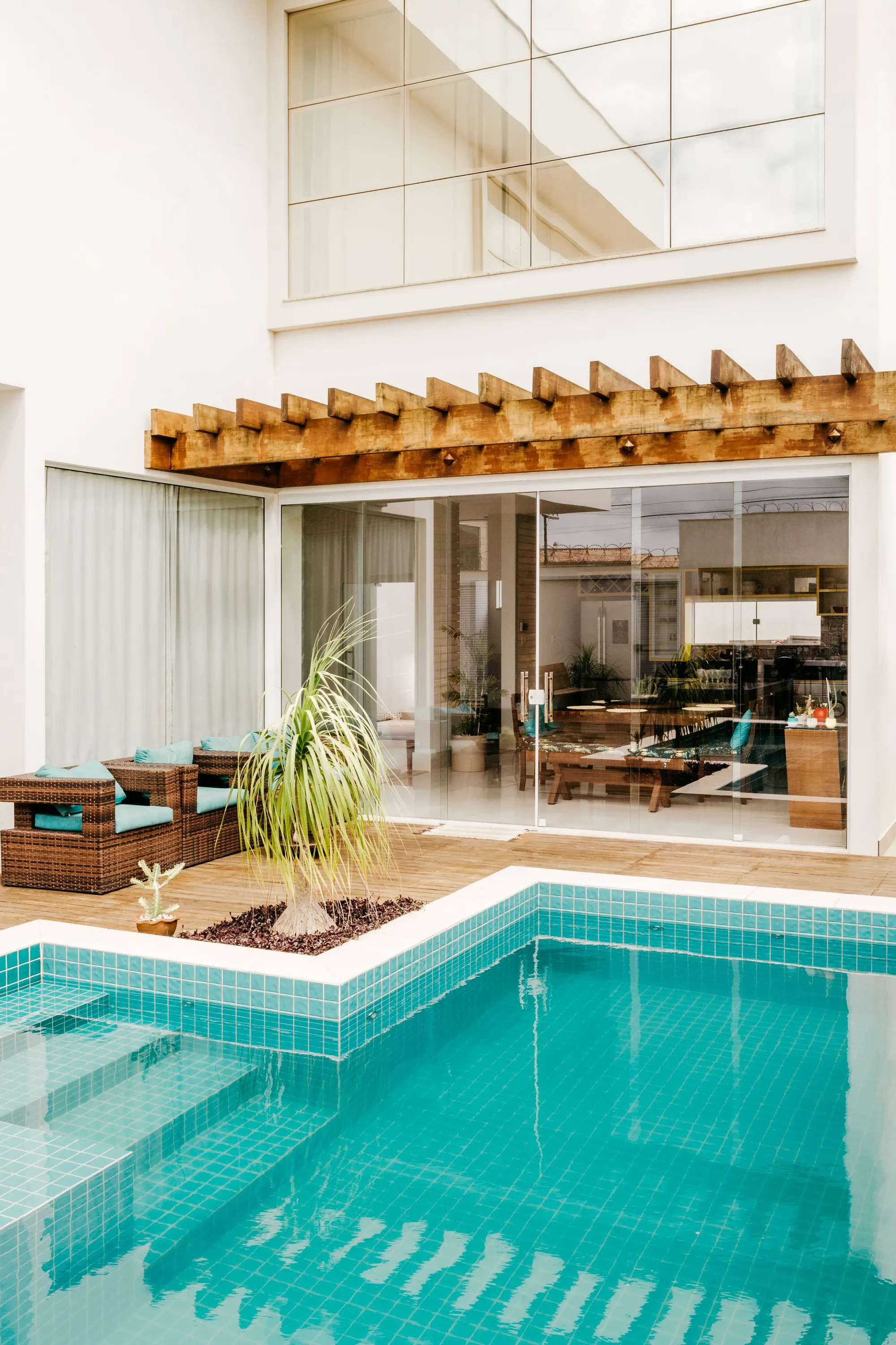 Tiled courtyard with a pool and pergola